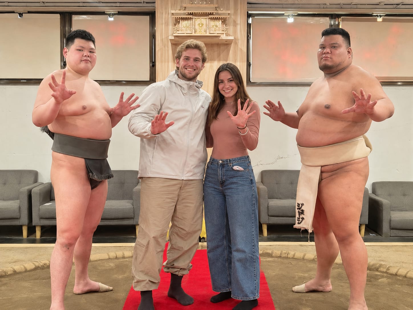 Two sumo wrestlers facing off before a bout