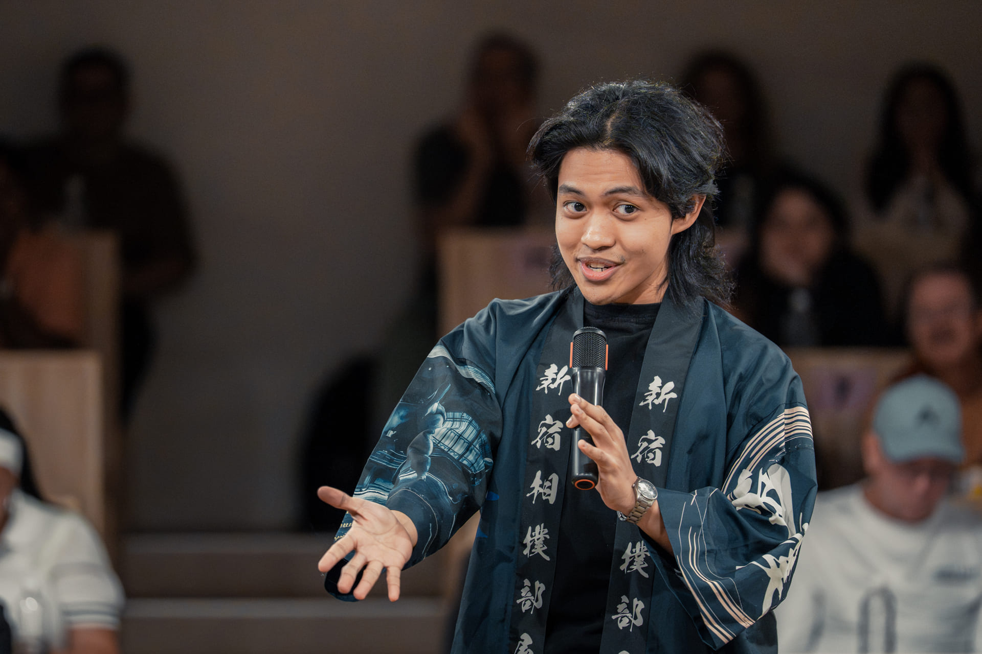English-speaking MC explaining sumo history and traditions
