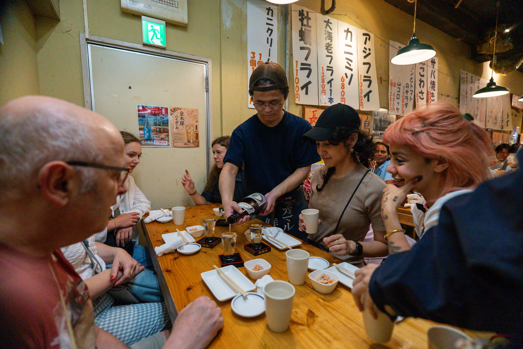 Guests enjoying authentic local food in Tokyo